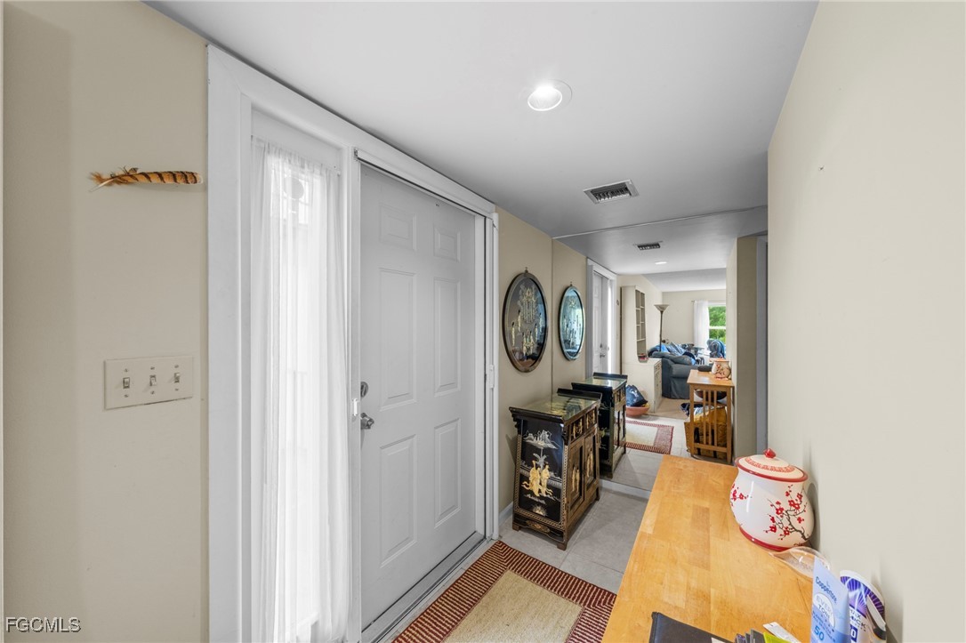 202 Bobolink Way, Unit 202B Naples, FL 34105 - Photo 25 of 31 a view of a livingroom with furniture and workspace