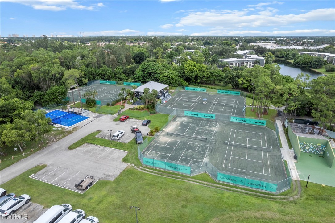 202 Bobolink Way, Unit 202B Naples, FL 34105 - Photo 27 of 31 an aerial view of a house with a yard