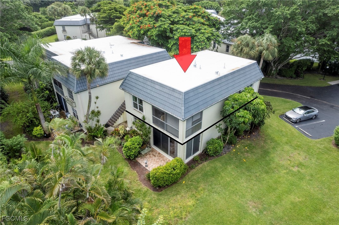 202 Bobolink Way, Unit 202B Naples, FL 34105 - Photo 29 of 31 a house view with a outdoor space