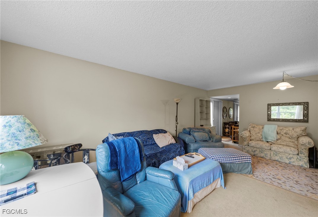 202 Bobolink Way, Unit 202B Naples, FL 34105 - Photo 10 of 31 a living room with furniture