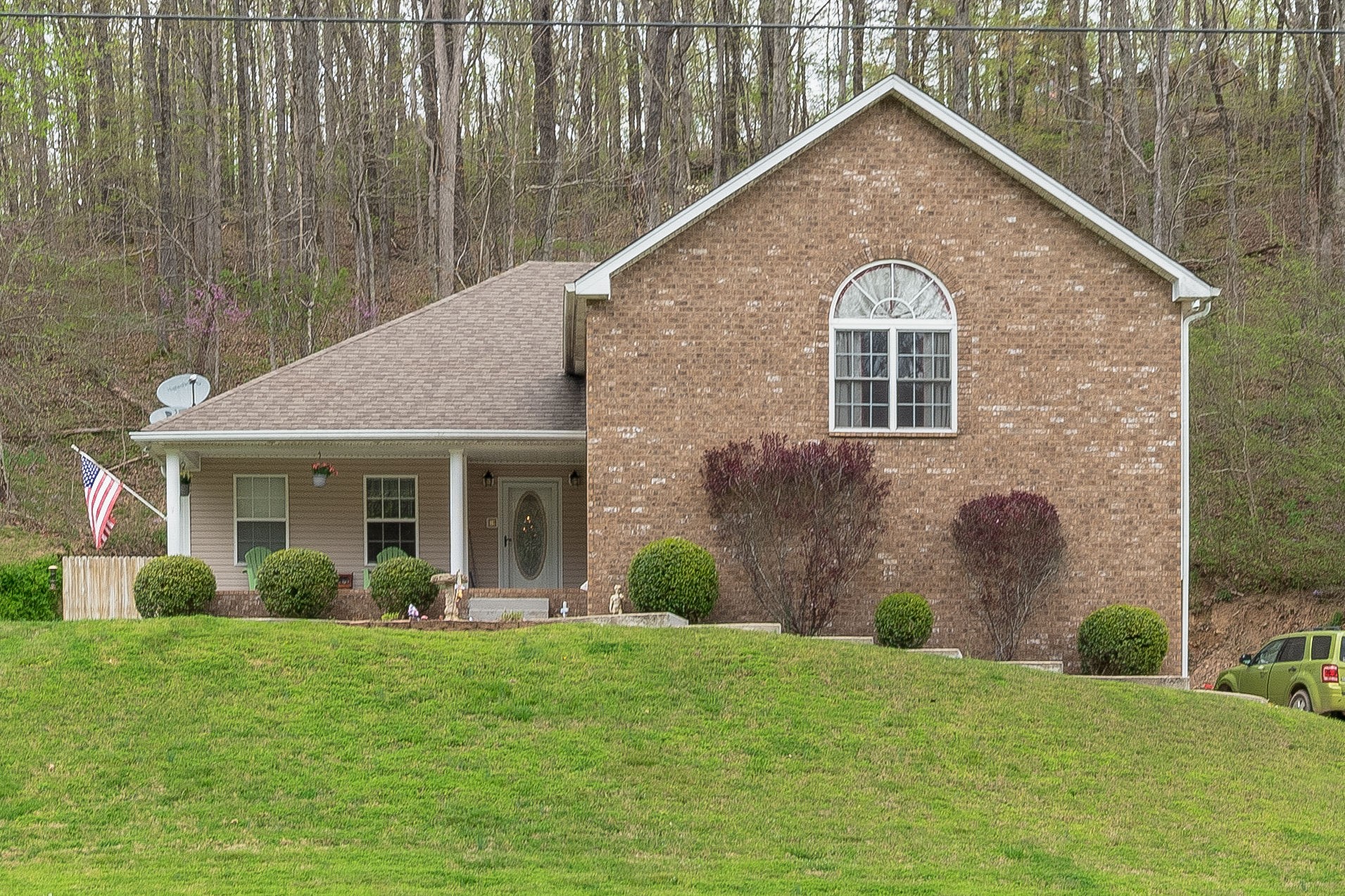 1112 Pee Dee Branch Road Cottontown, TN 37048 - Photo 1 of 33 a front view of a house with garden