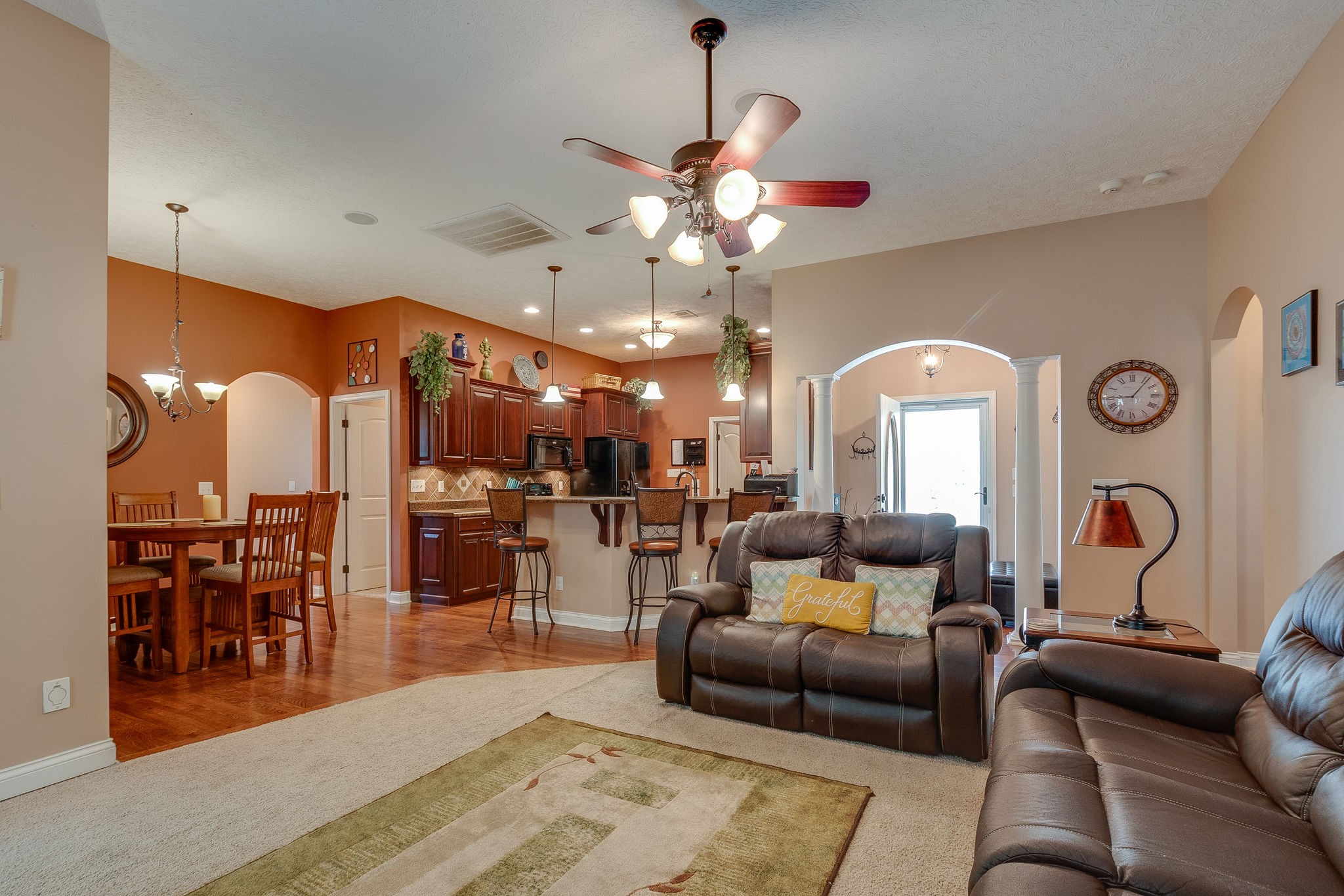 1112 Pee Dee Branch Road Cottontown, TN 37048 - Photo 12 of 33 a living room with furniture a chandelier and a dining table