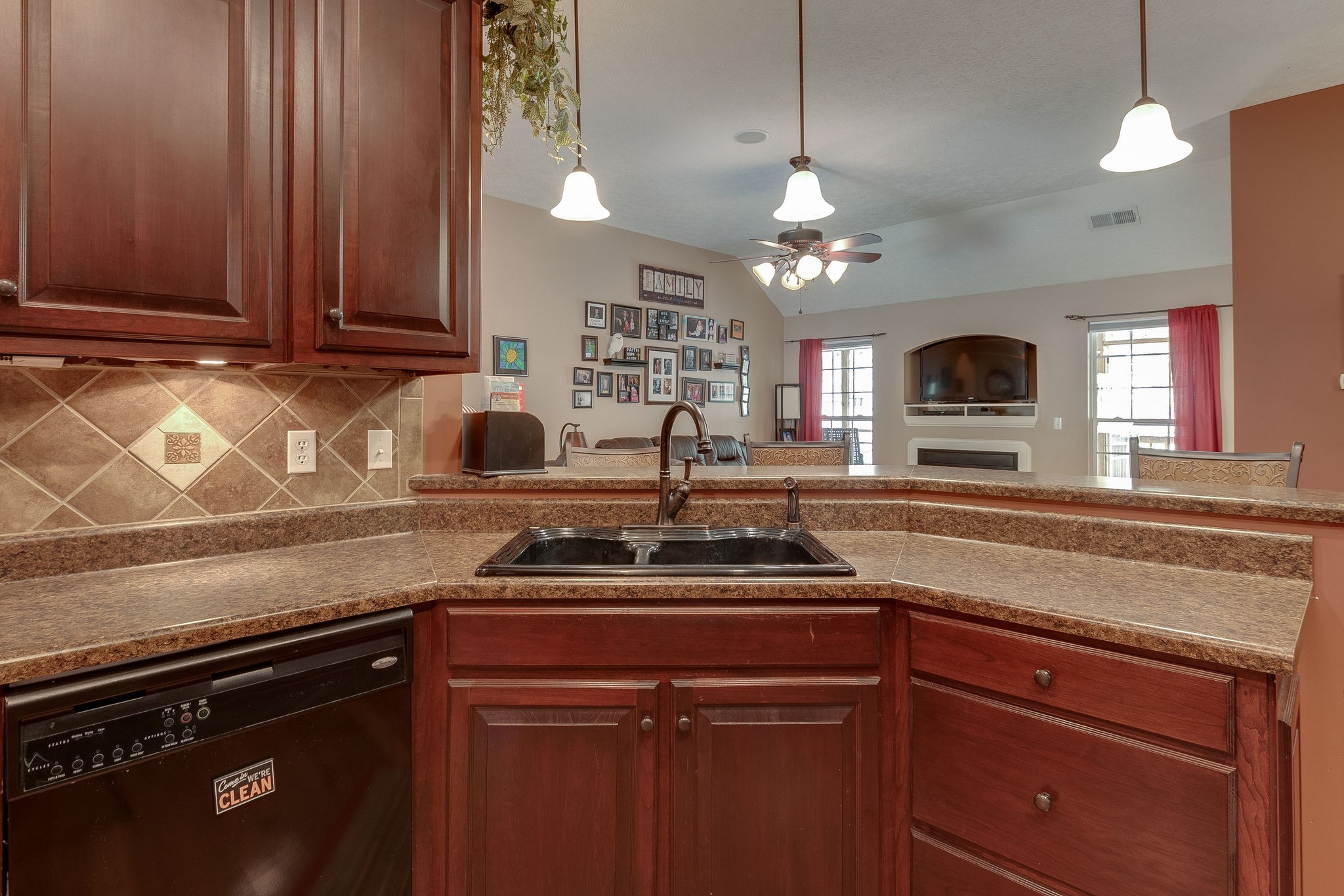 1112 Pee Dee Branch Road Cottontown, TN 37048 - Photo 18 of 33 a kitchen with stainless steel appliances granite countertop a sink a stove and a microwave