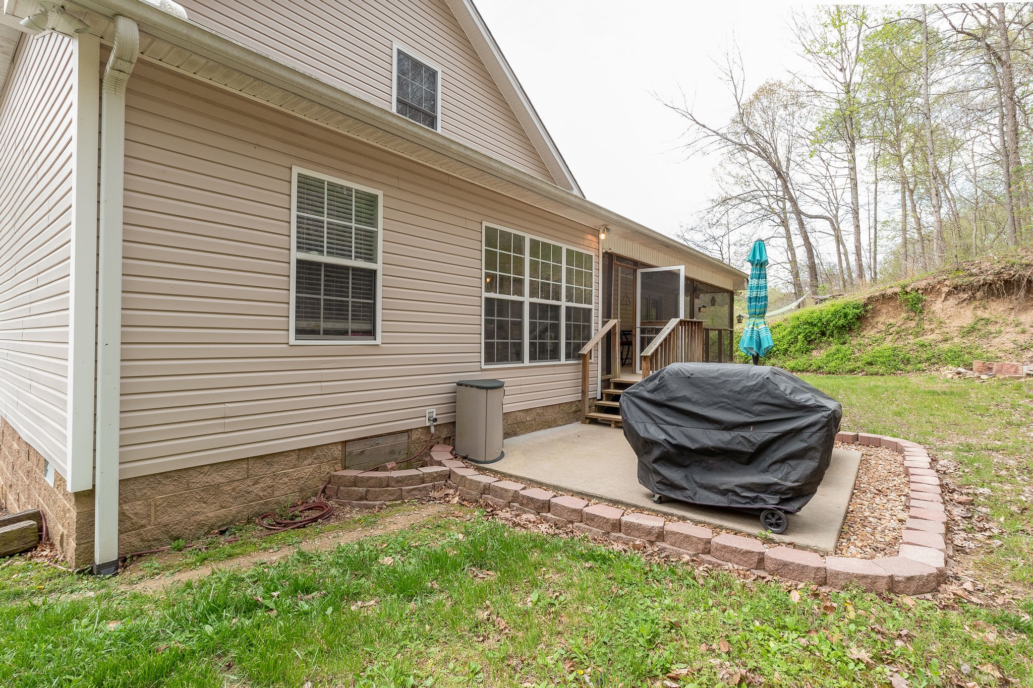 1112 Pee Dee Branch Road Cottontown, TN 37048 - Photo 31 of 33 a view of backyard with deck and outdoor seating