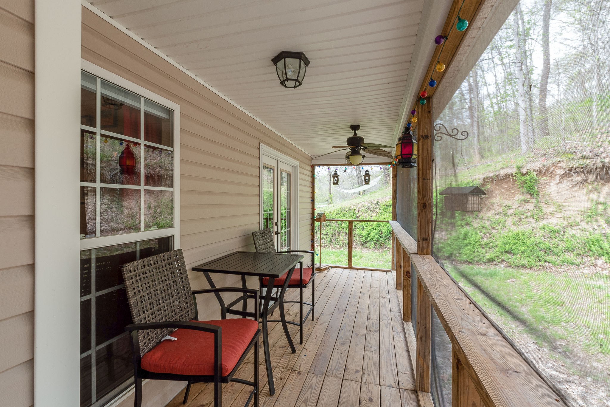 1112 Pee Dee Branch Road Cottontown, TN 37048 - Photo 32 of 33 a view of a chairs and table in patio with wooden floor