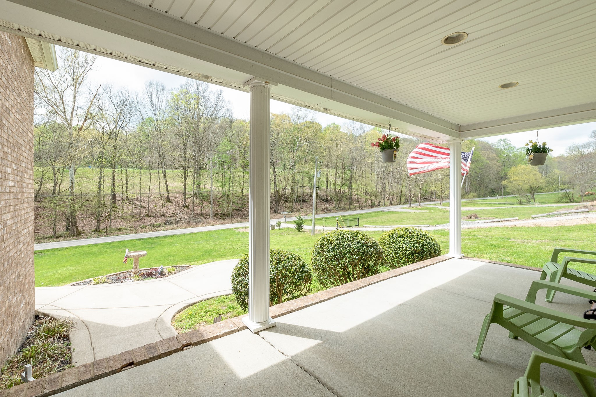 1112 Pee Dee Branch Road Cottontown, TN 37048 - Photo 6 of 33 a view of a porch with furniture and garden