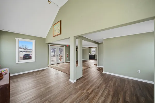 a spacious bedroom with a large bed and a window