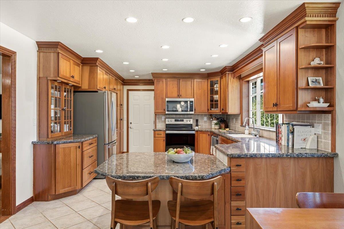 16856 Scott Way Grass Valley, CA 95949 - Photo 15 of 67 a kitchen with stainless steel appliances granite countertop a refrigerator and a stove top oven
