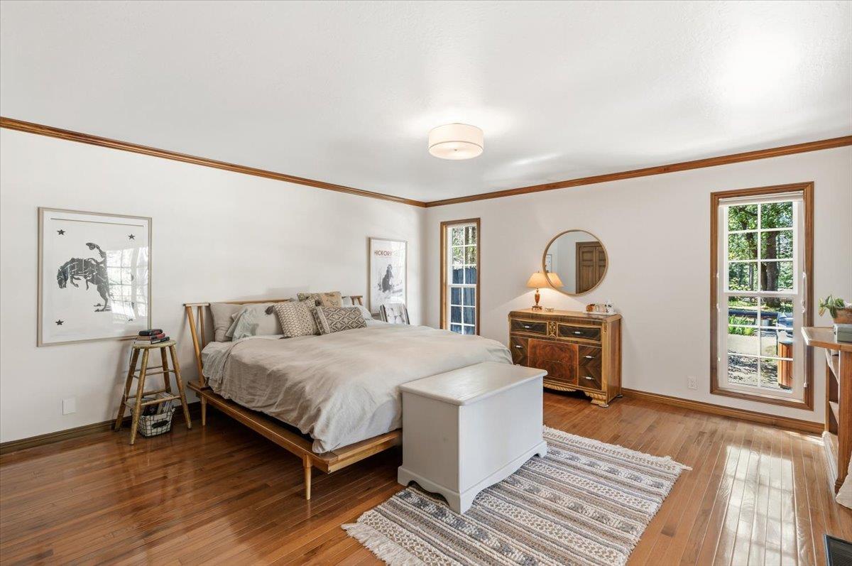16856 Scott Way Grass Valley, CA 95949 - Photo 21 of 67 a bedroom with a bed and wooden floor
