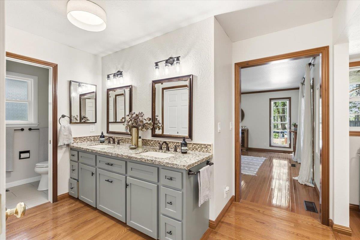 16856 Scott Way Grass Valley, CA 95949 - Photo 23 of 67 a bathroom with a double vanity sink and a mirror