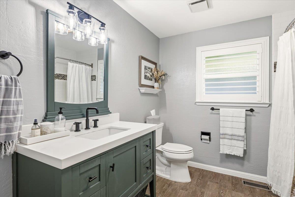 16856 Scott Way Grass Valley, CA 95949 - Photo 30 of 67 a bathroom with a toilet sink and mirror