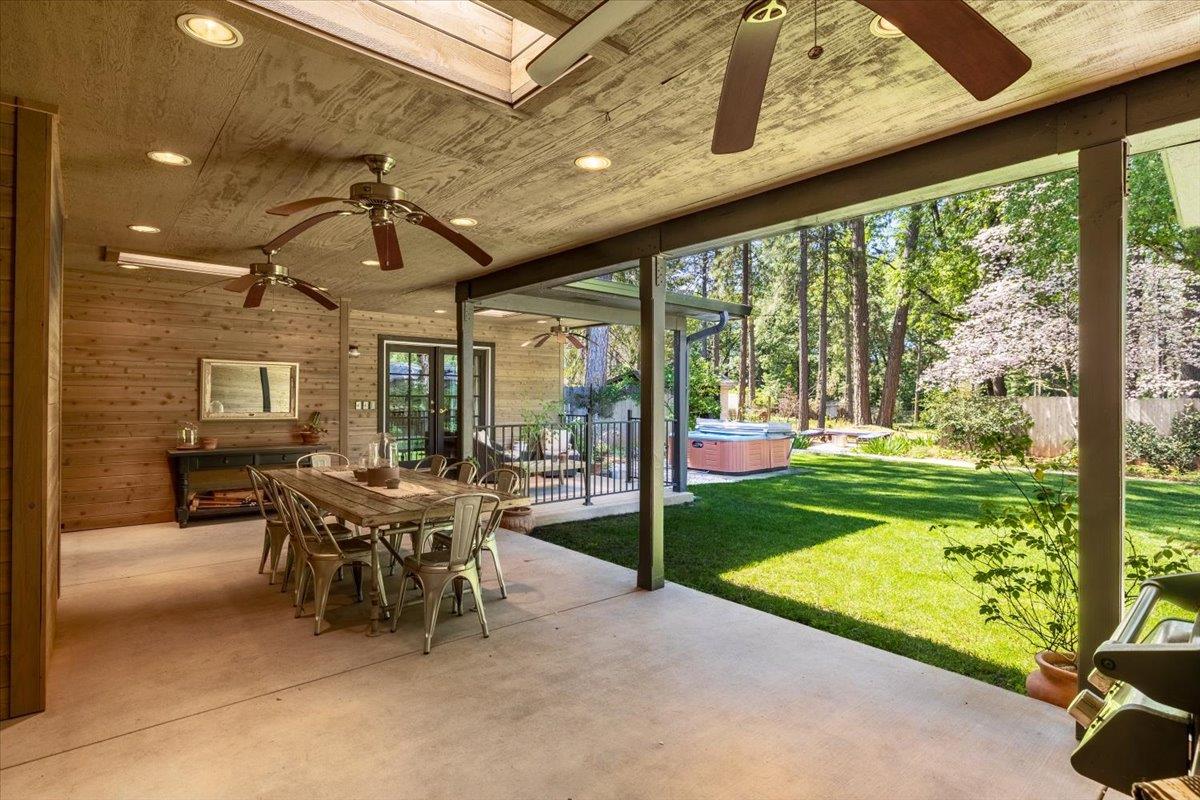 16856 Scott Way Grass Valley, CA 95949 - Photo 3 of 67 a view of a patio with a table chairs and a backyard