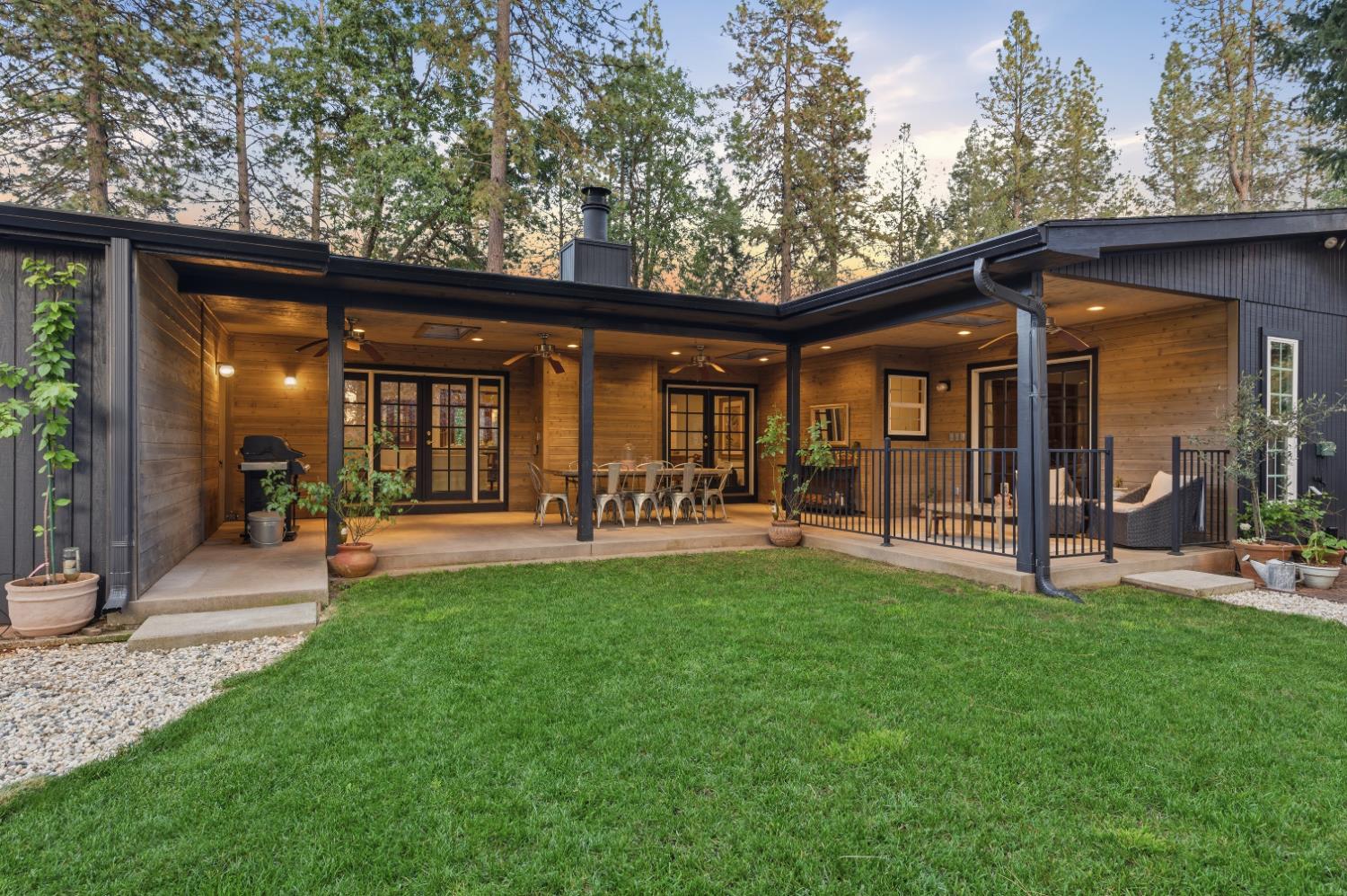 16856 Scott Way Grass Valley, CA 95949 - Photo 40 of 67 a view of a patio with table and chairs under an umbrella