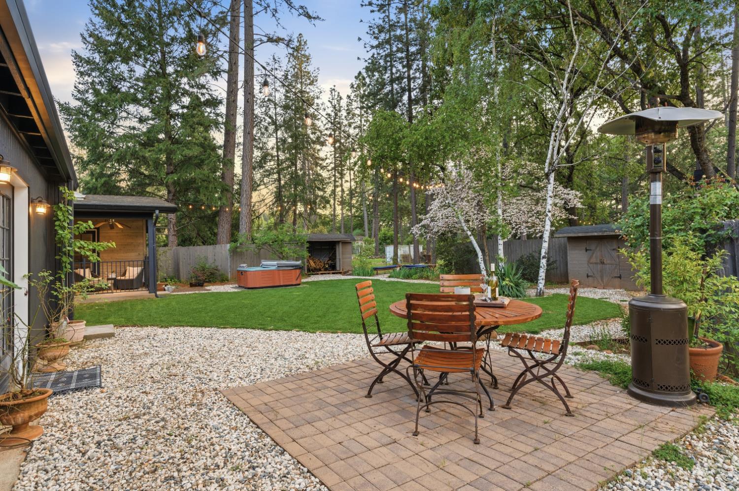 16856 Scott Way Grass Valley, CA 95949 - Photo 41 of 67 a view of a table and chairs in back yard of the house