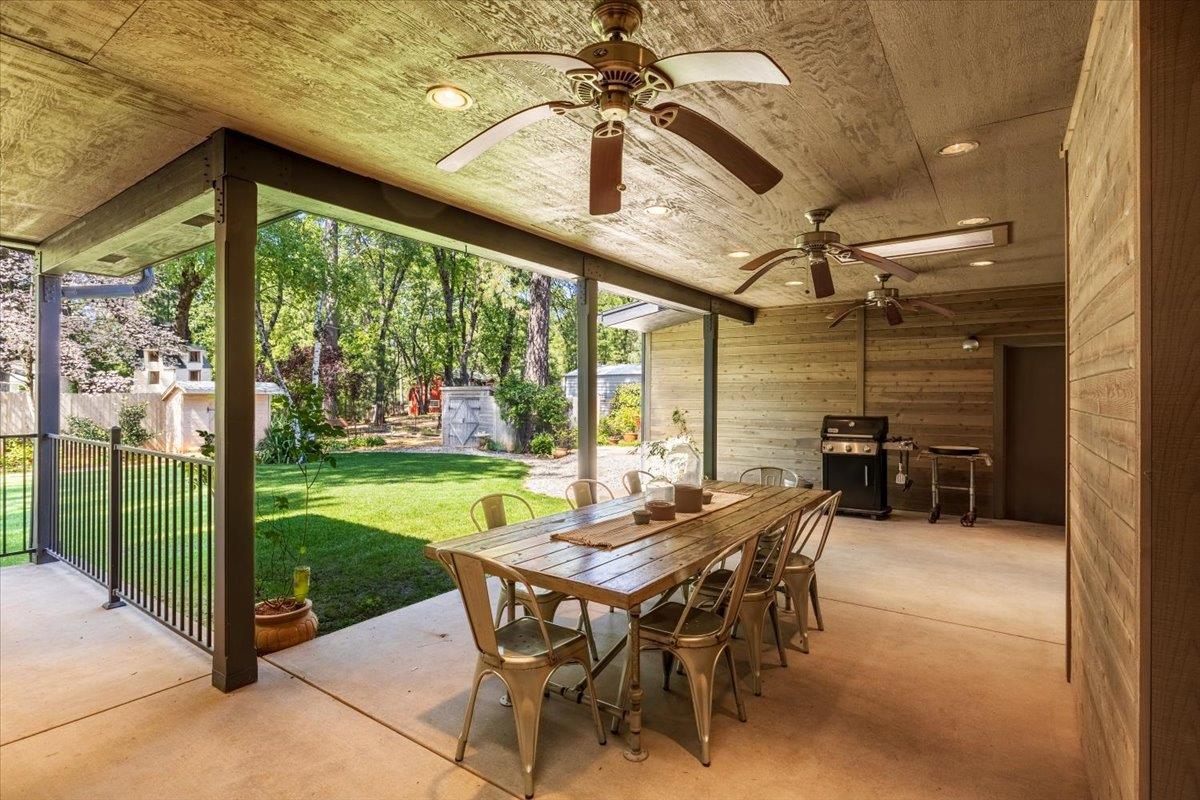 16856 Scott Way Grass Valley, CA 95949 - Photo 44 of 67 a view of a patio with a table chairs and a backyard