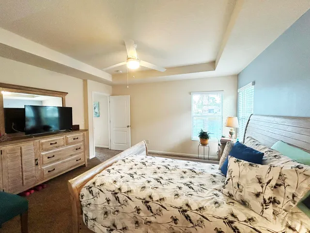 a bathroom with a sink a toilet and shower curtain