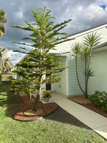 an aerial view of a houses with a lake view