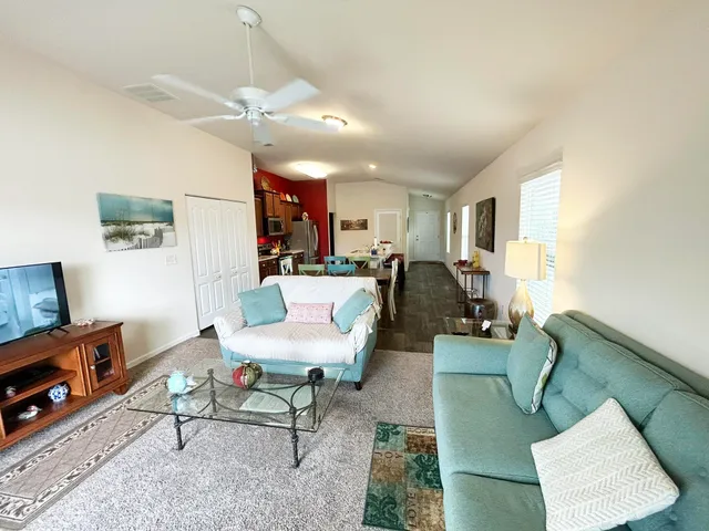 a living room with furniture and a window