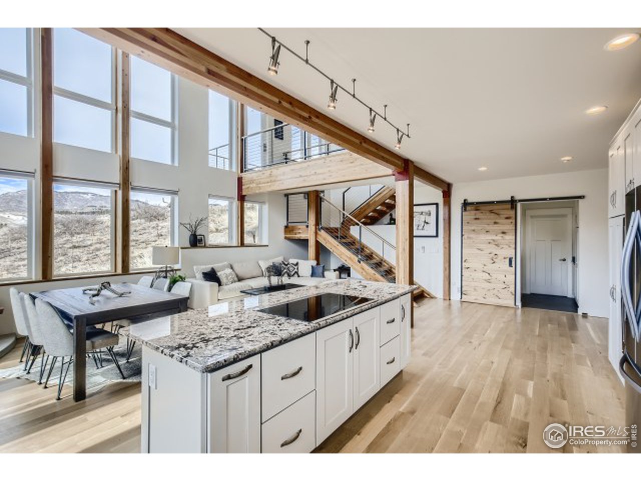 1133 Arroyo Chico Road Boulder, CO 80302 - Photo 13 of 37 a open kitchen with stainless steel appliances granite countertop a sink and a large window