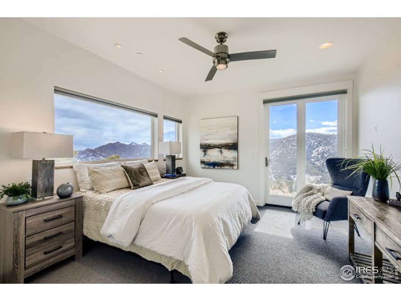 1133 Arroyo Chico Road Boulder, CO 80302 - Photo 15 of 37 a bedroom with a large bed and a window