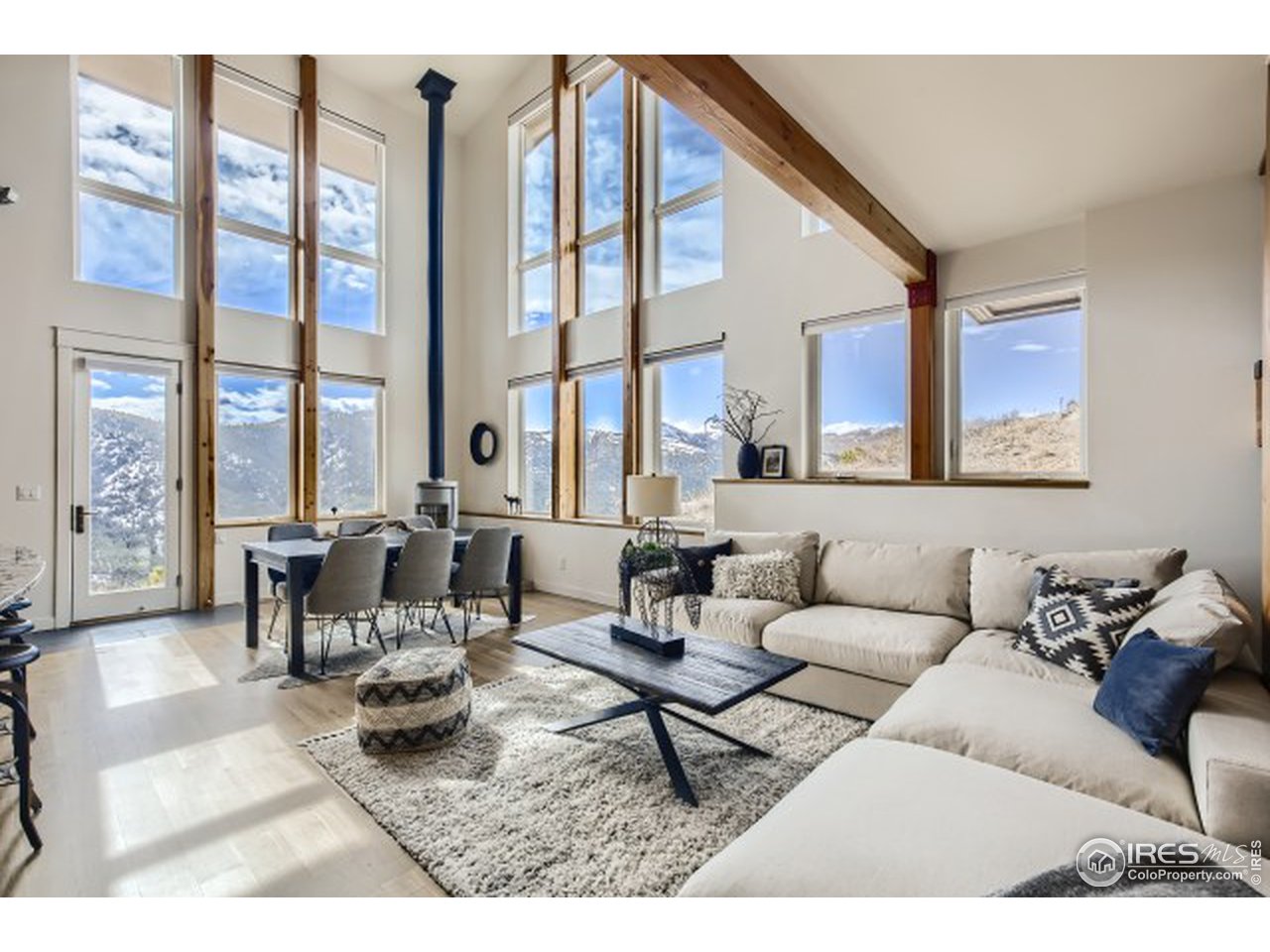 1133 Arroyo Chico Road Boulder, CO 80302 - Photo 3 of 37 a living room with furniture and a large window