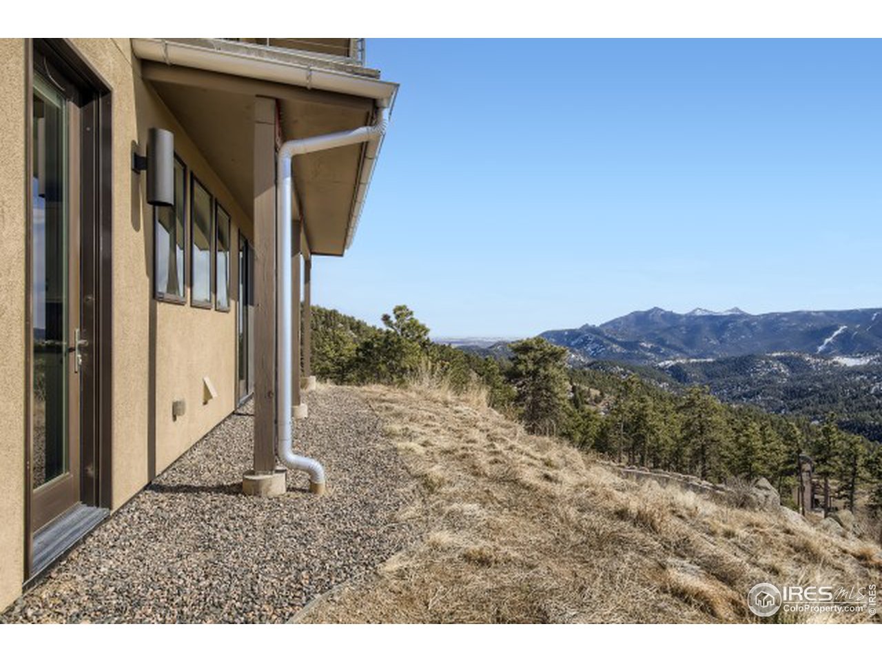 1133 Arroyo Chico Road Boulder, CO 80302 - Photo 31 of 37 a view of a house with a mountain view