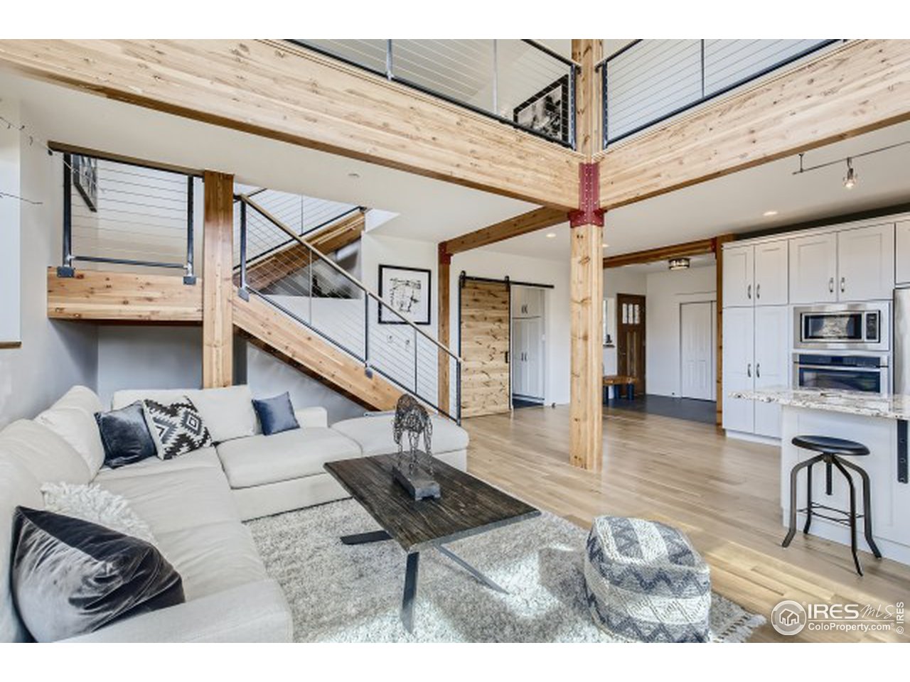 1133 Arroyo Chico Road Boulder, CO 80302 - Photo 4 of 37 a living room with furniture and a table