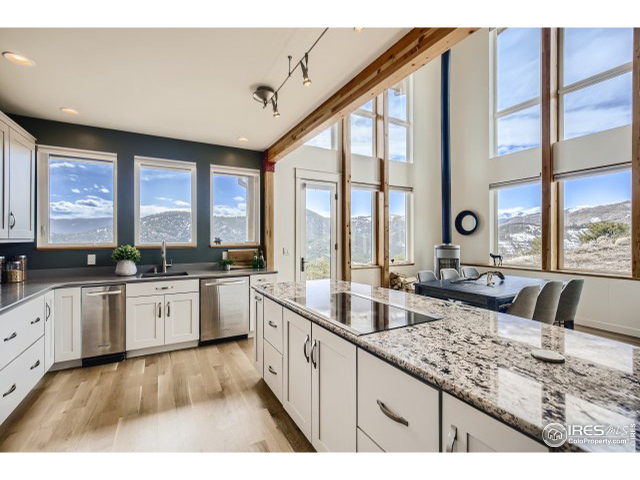 1133 Arroyo Chico Road Boulder, CO 80302 - Photo 9 of 37 a large white kitchen with a large window