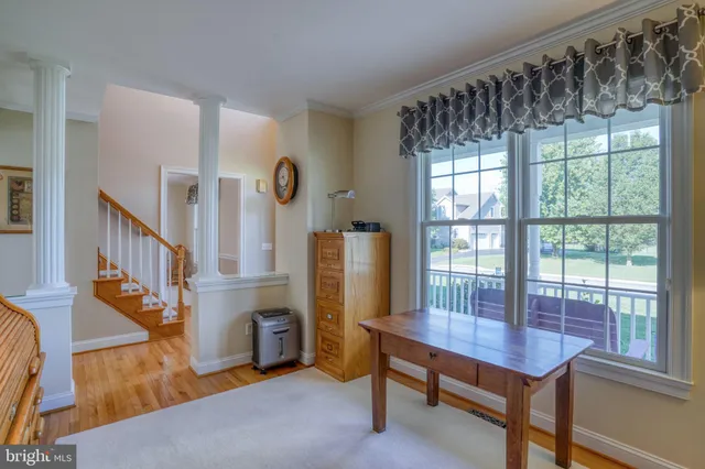 a view of a room with furniture and a window