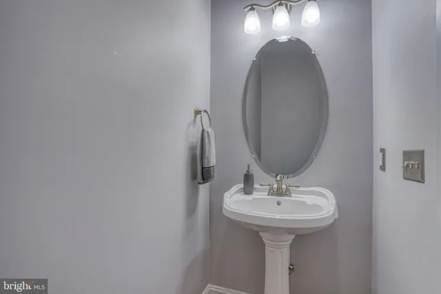 a kitchen with stainless steel appliances kitchen island granite countertop a refrigerator a stove a sink dishwasher with a dining table and chairs