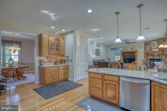 a large kitchen with a table and chairs
