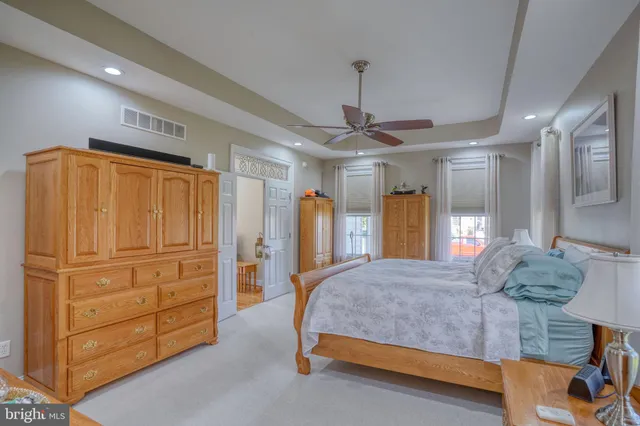 a bathroom with a granite countertop double vanity sink and a mirror