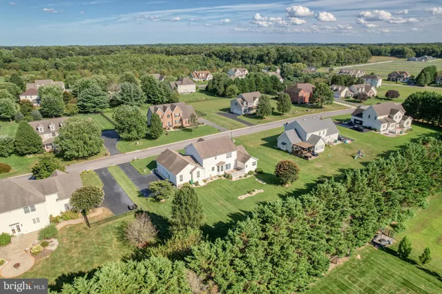 an aerial view of a house with a garden