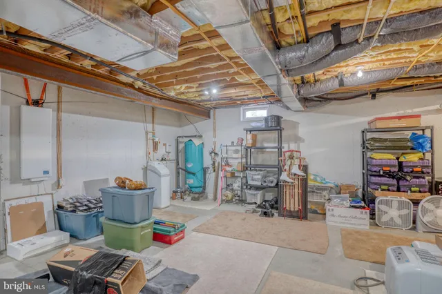 an aerial view of a house with a garden and lake view