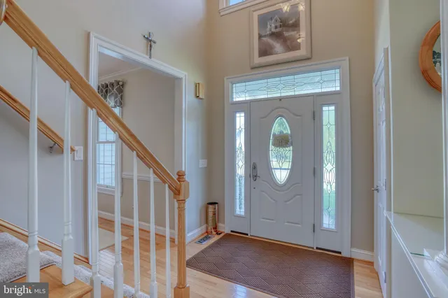 a view of an entryway with wooden floor