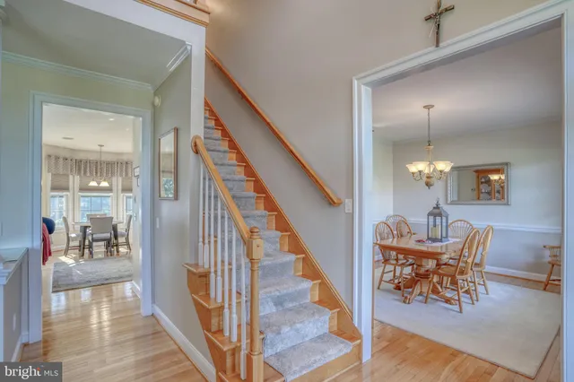a workspace with wooden floor and furniture