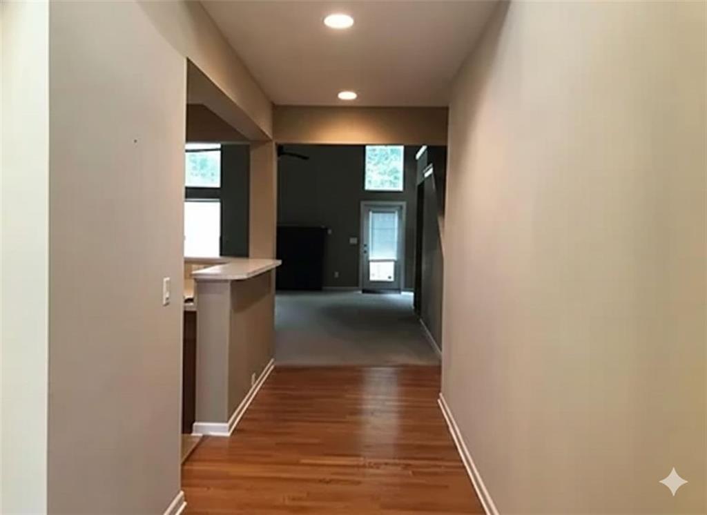 7923 Keepsake Lane Flowery Branch, GA 30542 - Photo 2 of 6 a view of gallery with stairs