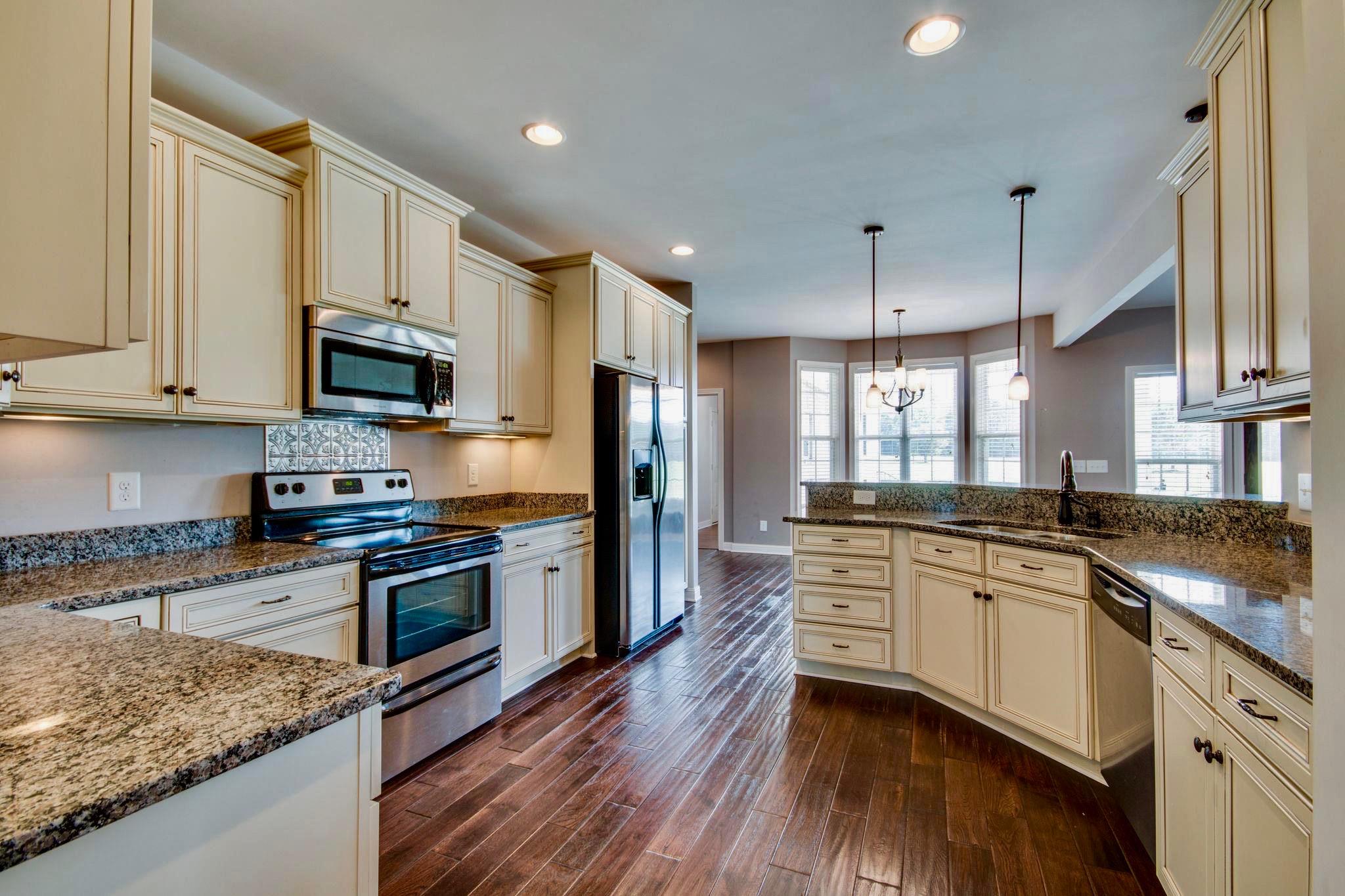 11187 South Windrow Road Rockvale, TN 37153 - Photo 8 of 26 Granite countertops, plenty of cabinet space & a pantry for all that great cooking time.