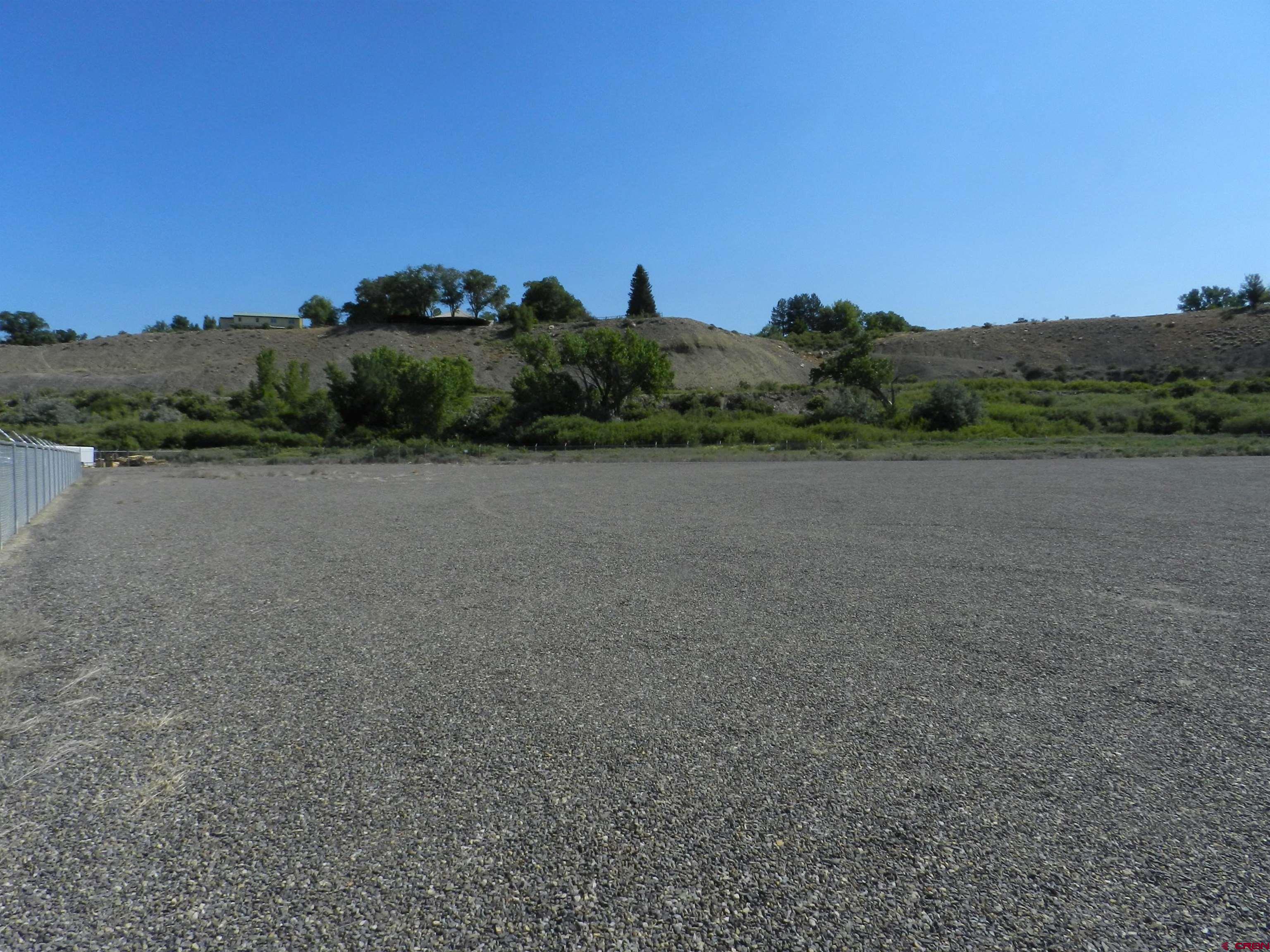 Tbd 6225th Road, Unit LOT LEASE Montrose, CO 81401 - Photo 11 of 14 a view of an outdoor space and a yard