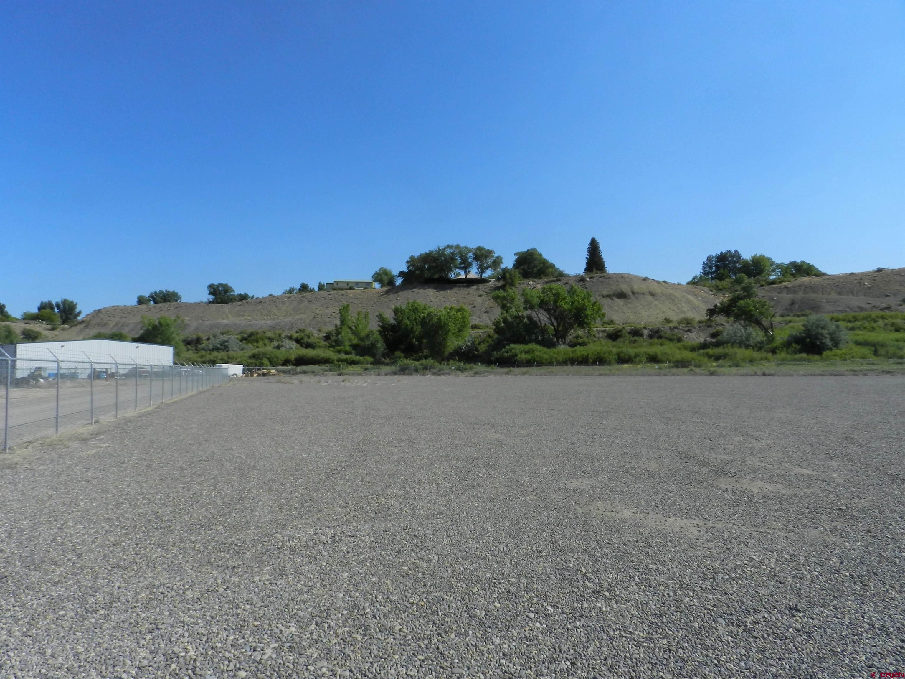 Tbd 6225th Road, Unit LOT LEASE Montrose, CO 81401 - Photo 8 of 14 a view of a field with an ocean view