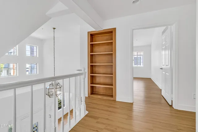 a view of an entryway with wooden floor