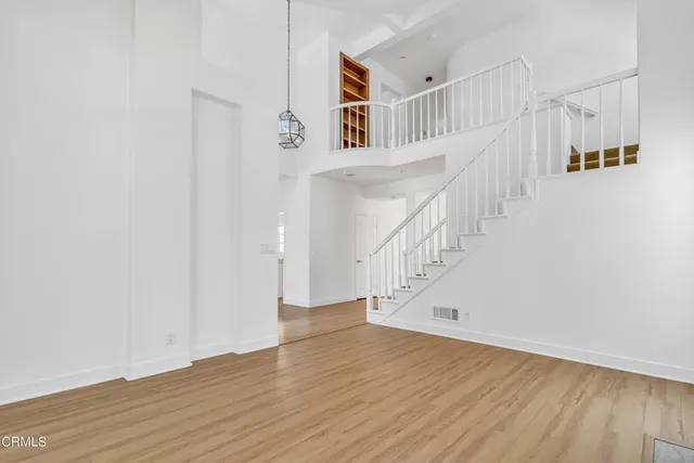 a view of entryway with wooden floor