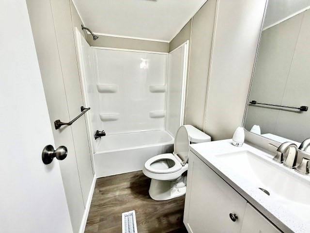 409 Cross Creek Road Longview, TX 75602 - Photo 13 of 14 a bathroom with a sink toilet and shower