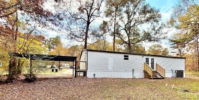 409 Cross Creek Road Longview, TX 75602 - Photo 3 of 14 a view of a house with a large tree