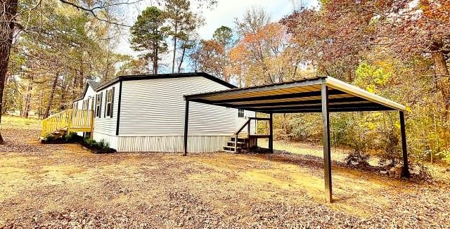 409 Cross Creek Road Longview, TX 75602 - Photo 4 of 14 a view of a house with a yard