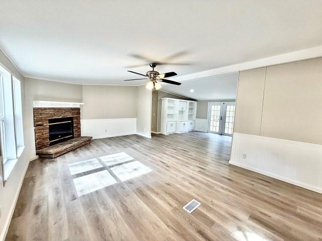 409 Cross Creek Road Longview, TX 75602 - Photo 7 of 14 a view of livingroom with hardwood floor and a ceiling fan