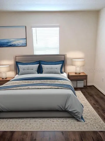 a bedroom with a bed and window