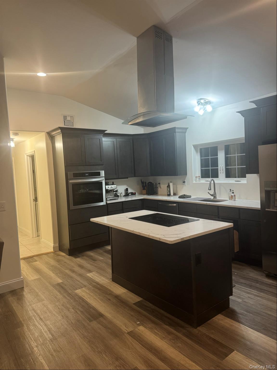 198 Pleasant Ridge Road Poughquag, NY 12570 - Photo 14 of 27 a kitchen with stainless steel appliances kitchen island granite countertop a sink and a refrigerator