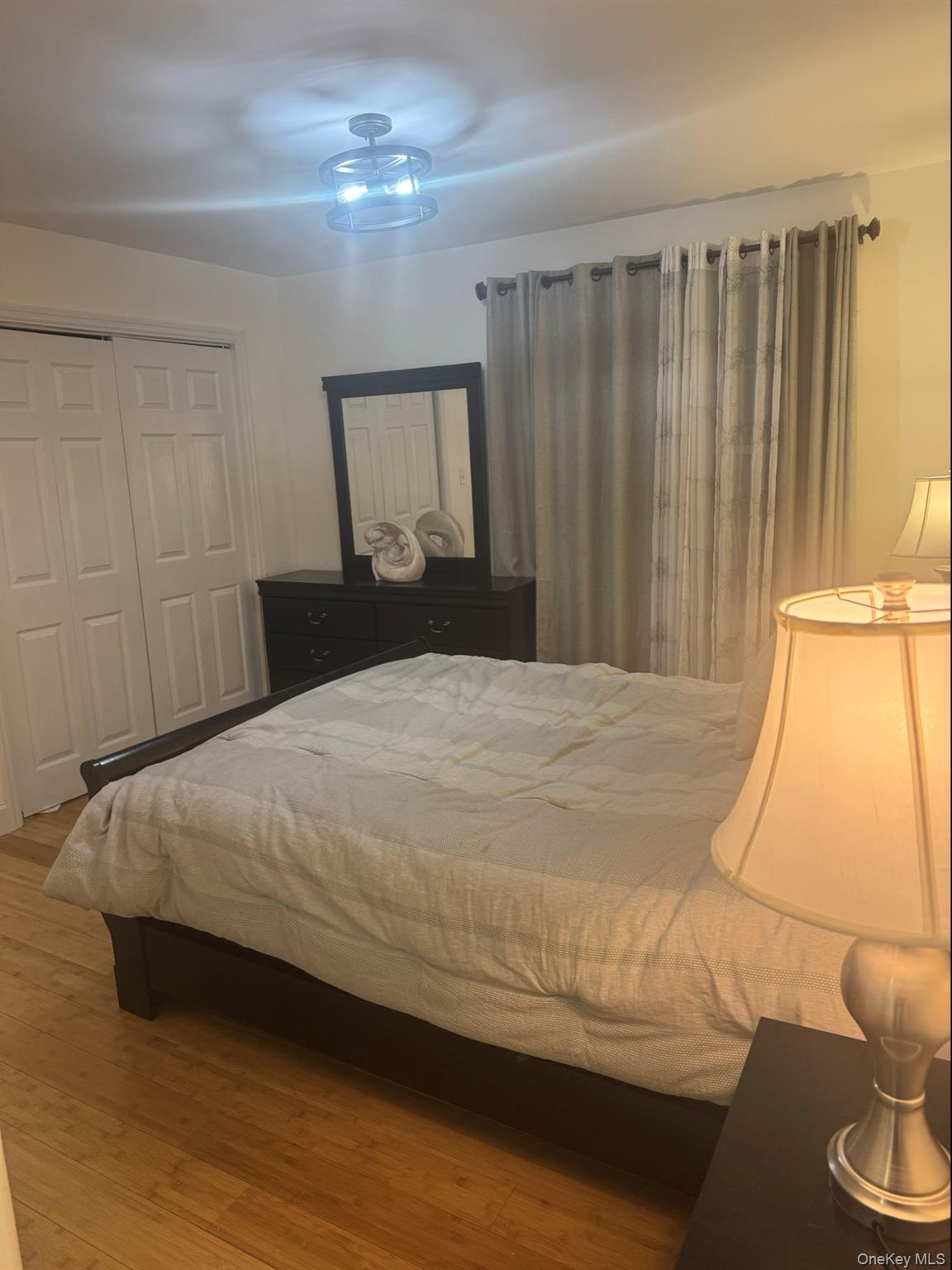 198 Pleasant Ridge Road Poughquag, NY 12570 - Photo 17 of 27 a bedroom with a bed and a night stand