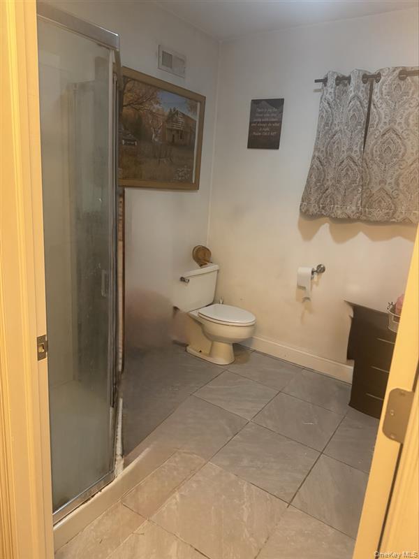 198 Pleasant Ridge Road Poughquag, NY 12570 - Photo 24 of 27 a bathroom with a toilet sink and shower